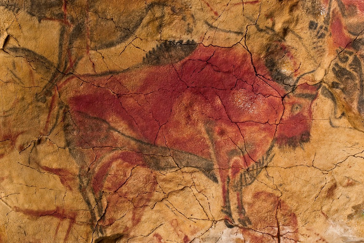 Polychrome bison painting on the ceiling of the Cave of Altamira, painted approximately 14,000 years ago during the Upper Paleolithic
