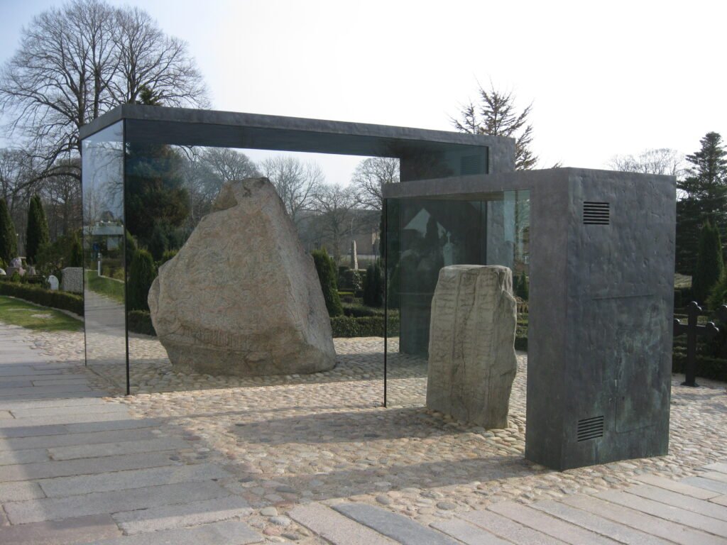 The two Jelling runestones with the church behind, Jelling, Denmark