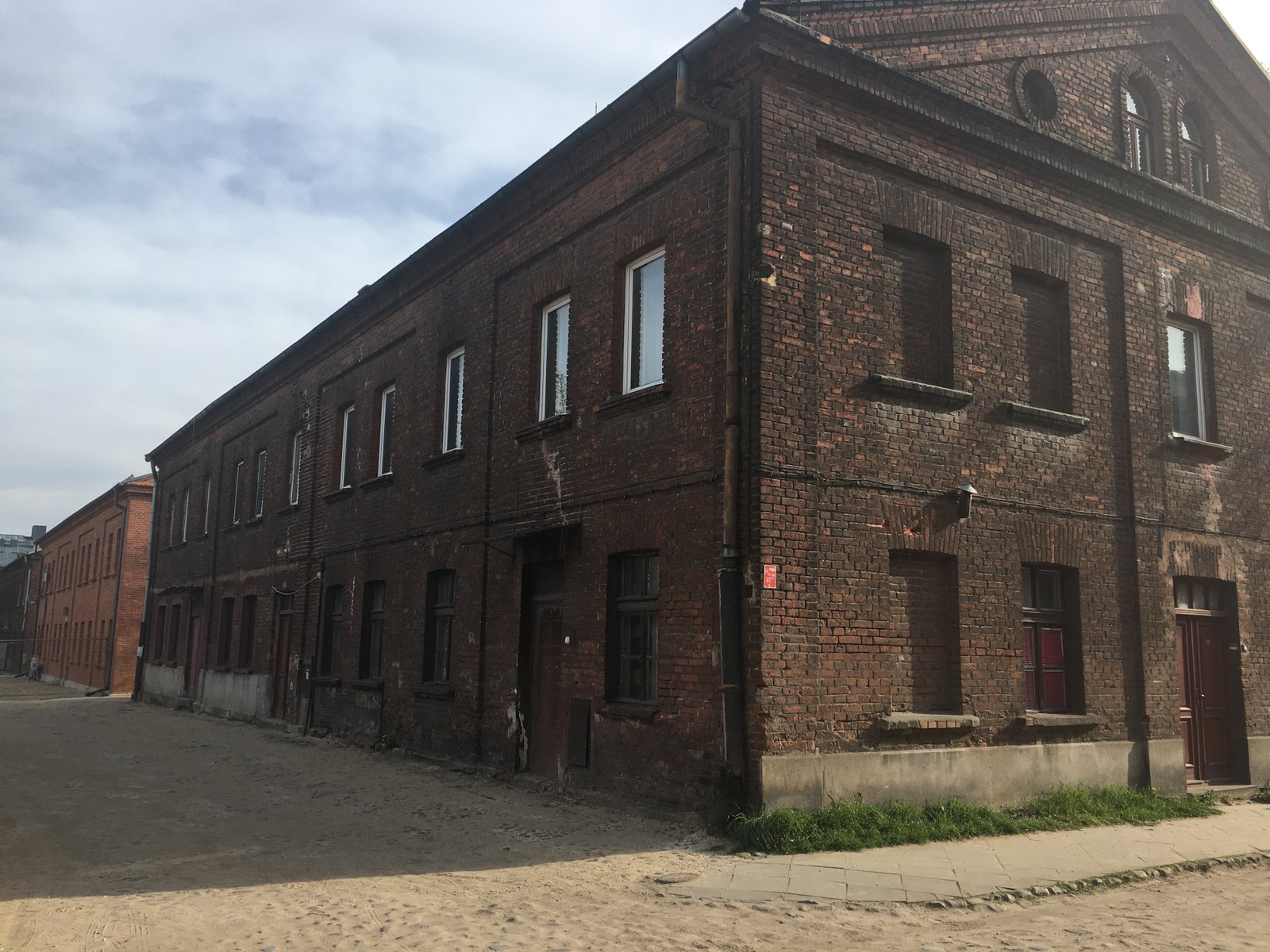 Księży Młyn — rows of red-brick workers' houses (famuły) in Karol Scheibler's model factory settlement, Łódź