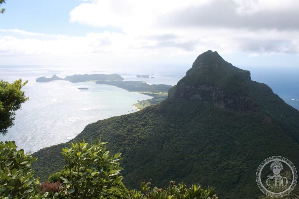The forested peak of Mount Lidgbird above the lagoon and islets of Lord Howe Island