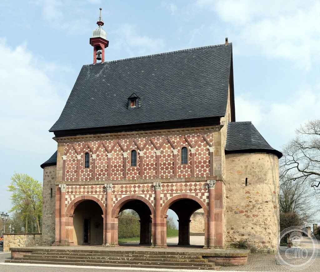 The patterned red-and-white stone Carolingian gatehouse (Königshalle) of Lorsch Abbey