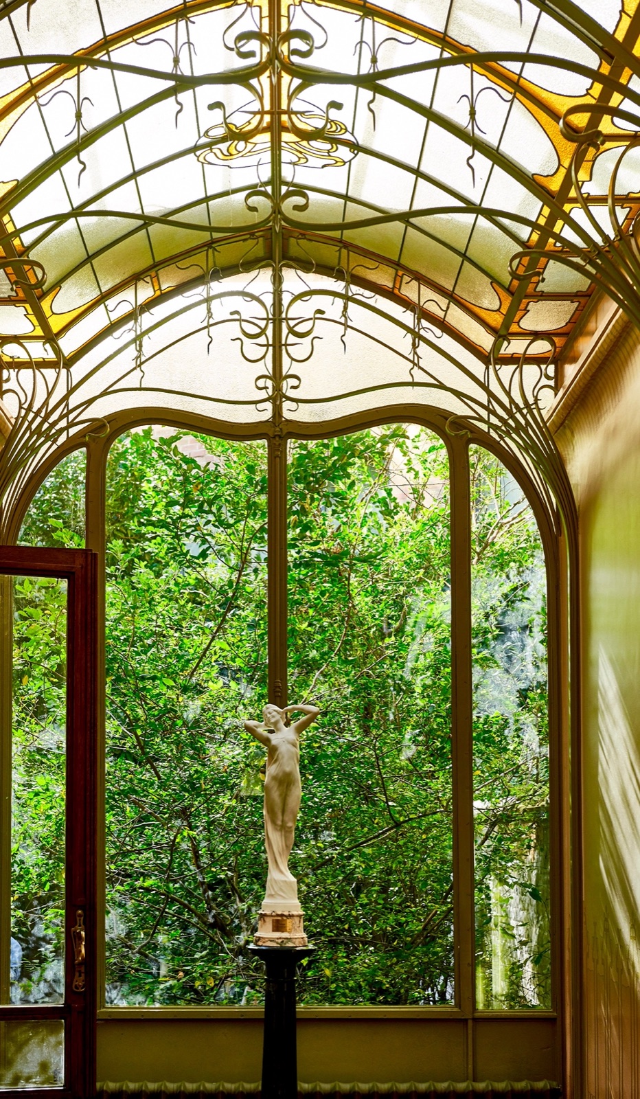 Winter garden of Maison Frison, Brussels, with Victor Horta ironwork and glazed roof