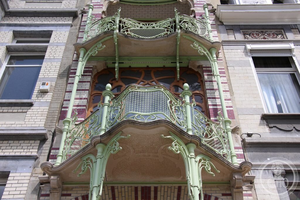 The narrow wrought-iron façade of the Saint-Cyr House on Square Ambiorix