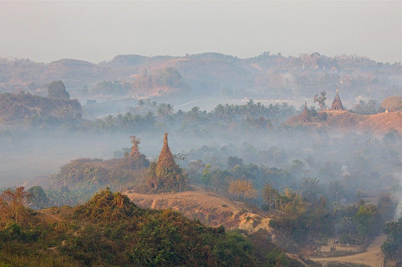 Shitthaung temple at Mrauk-U, Myanmar, surrounded by jungle with distant stupas