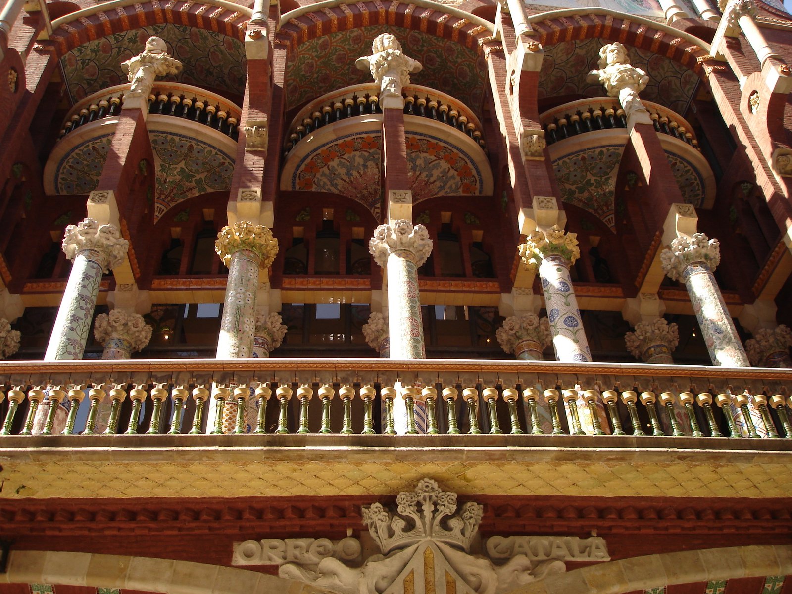 Mosaic columns and sculpted upper facade of the Palau de la Música Catalana in Barcelona