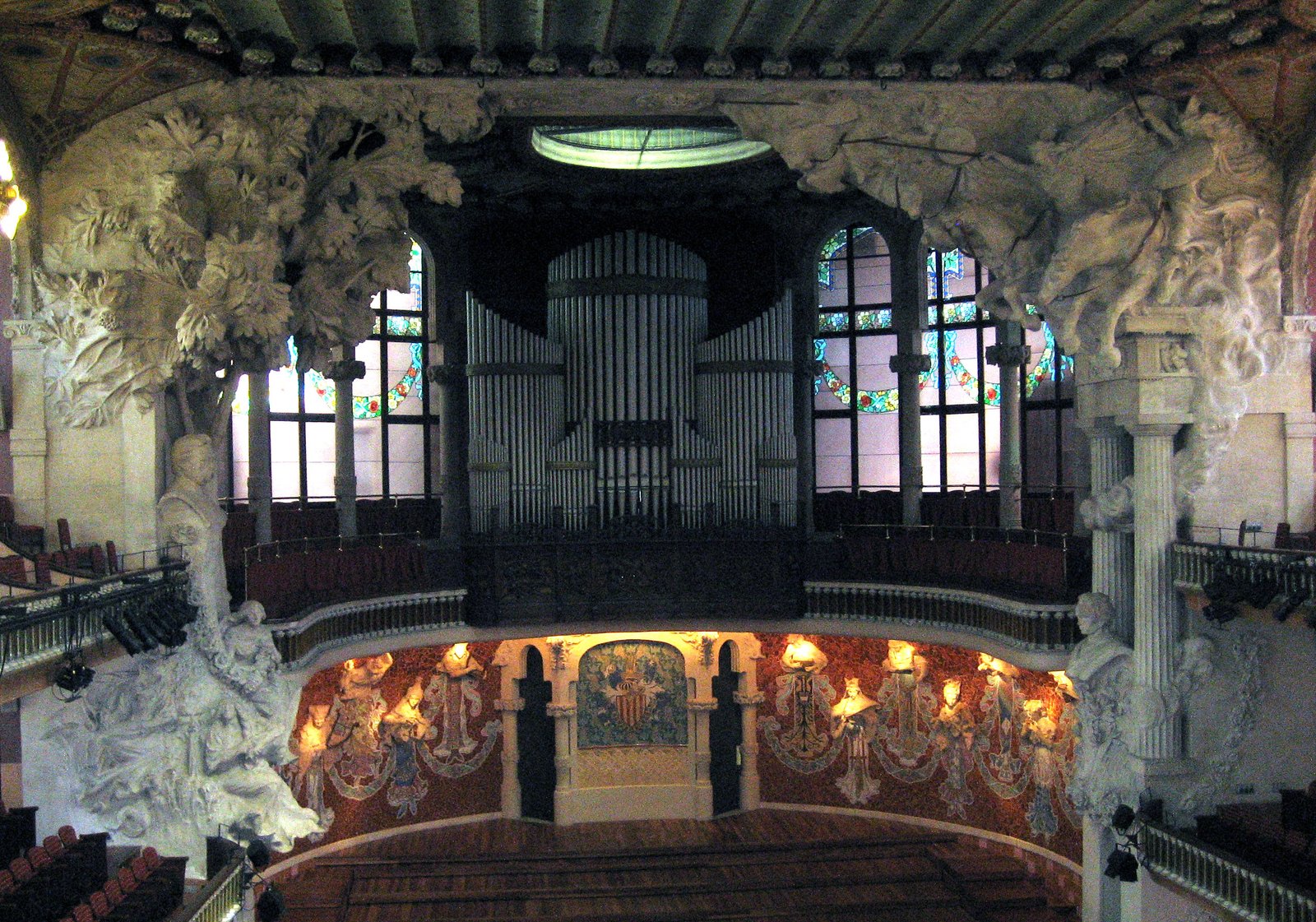 The stage of the Palau with its half-relief muses around the proscenium