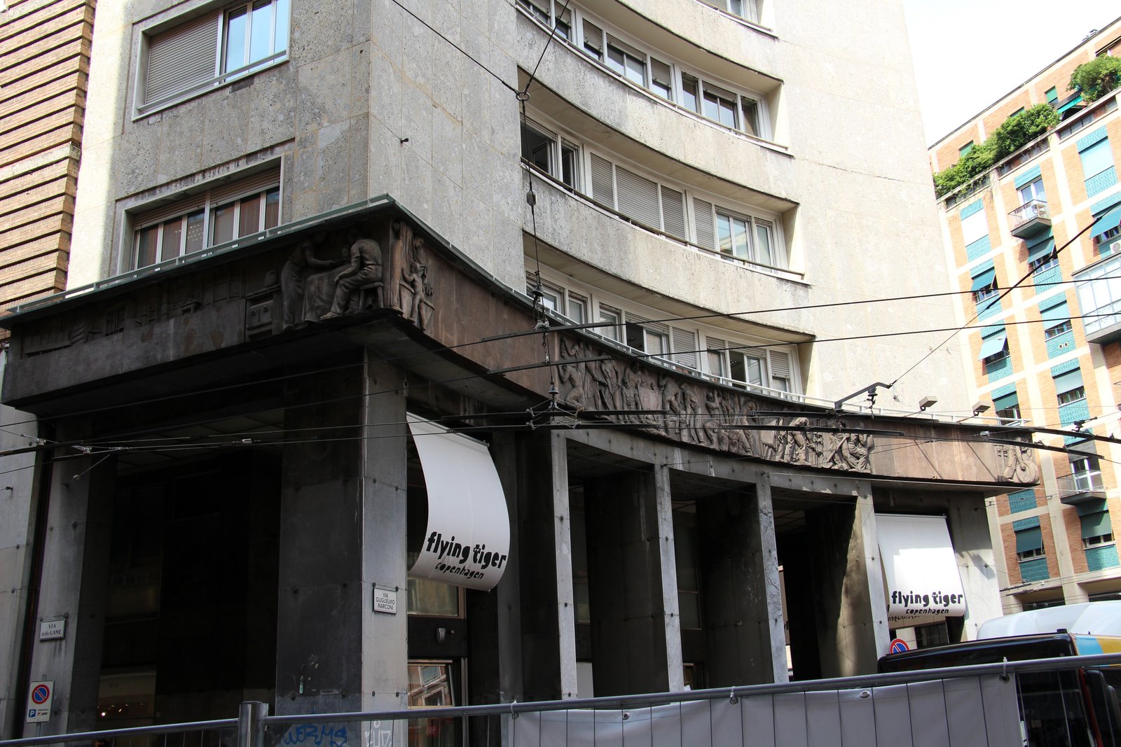 Facade of Palazzo del Gas in Bologna with its rationalist frieze along Via Marconi