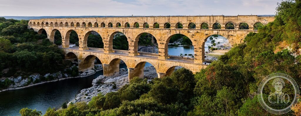 The three tiers of arches of the Pont du Gard Roman aqueduct crossing the river Gardon