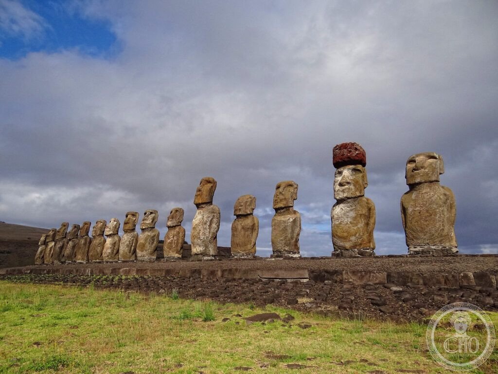 A row of giant stone moai statues on a stone platform at Ahu Tongariki, Easter Island
