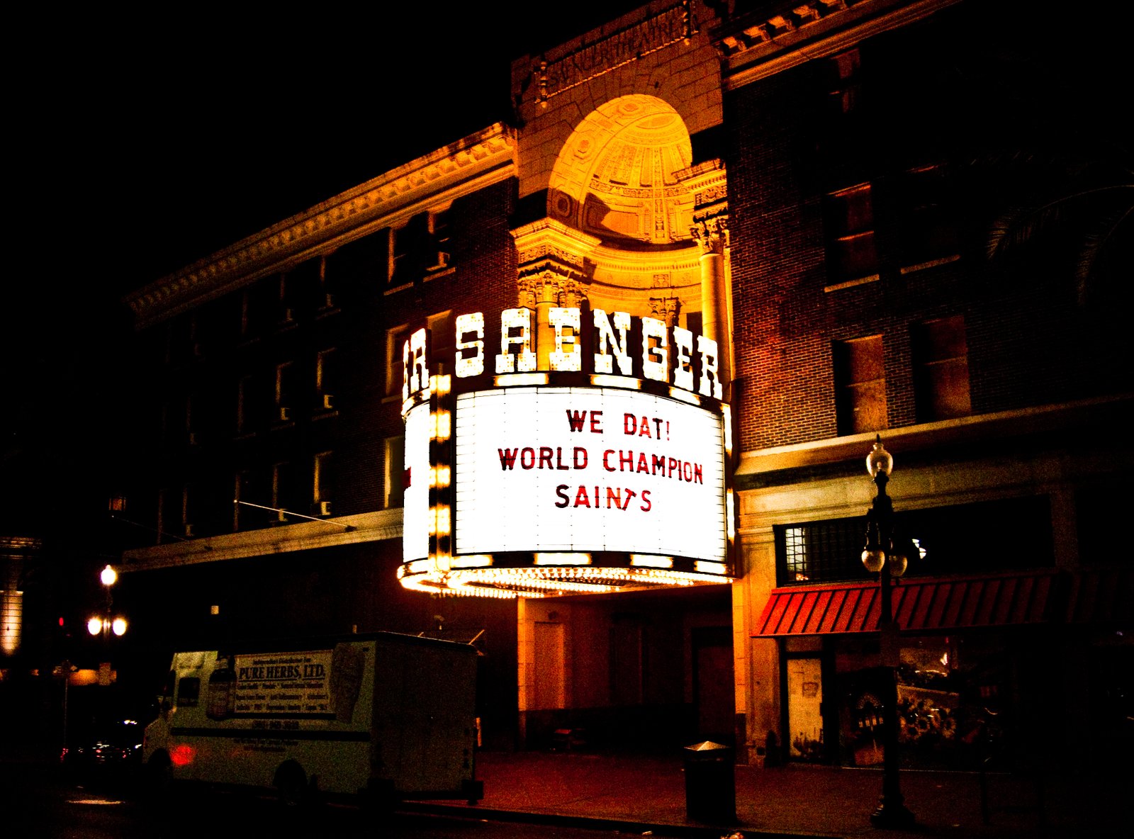 Saenger Theatre on Canal Street, New Orleans — illuminated facade at night with marquee
