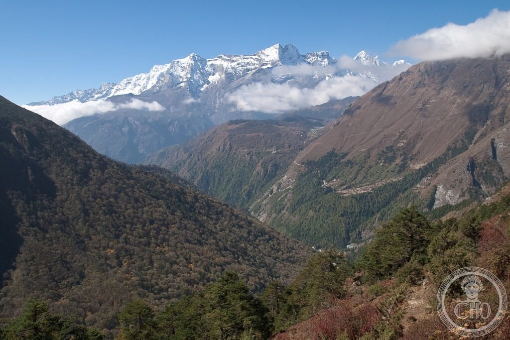 Snow-capped Himalayan peaks above a valley with a monastery and village near Tengboche, Nepal