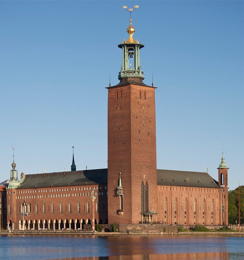 The brick tower of Stockholm City Hall reflected in Lake Mälaren The brick tower of Stockholm City Hall reflected in Lake Mälaren
