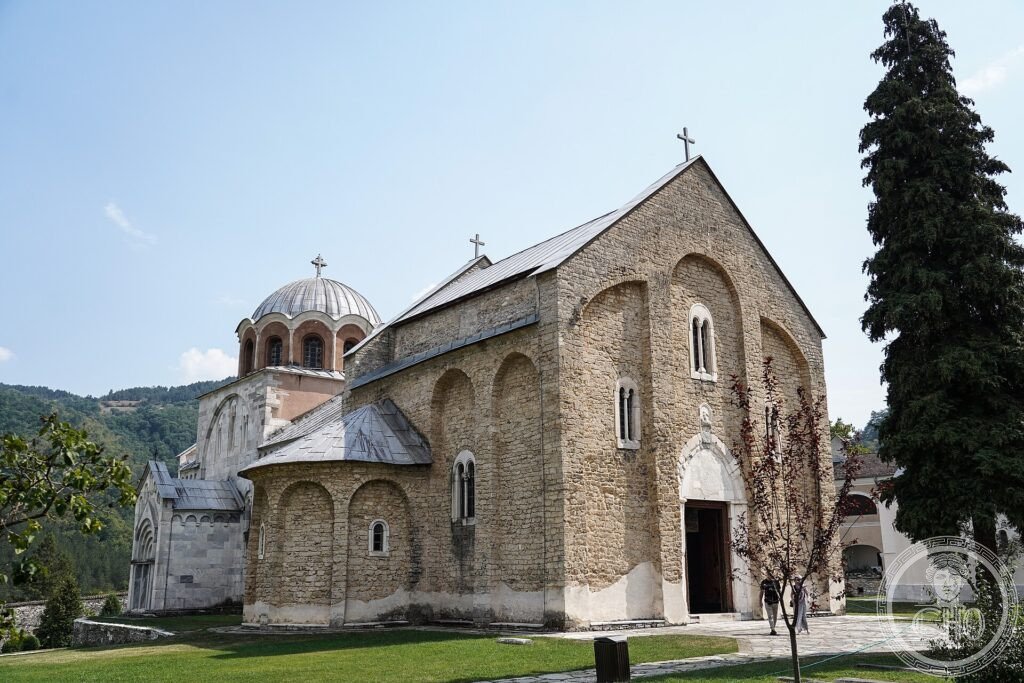 The white marble Church of the Virgin at Studenica Monastery among green hills in Serbia