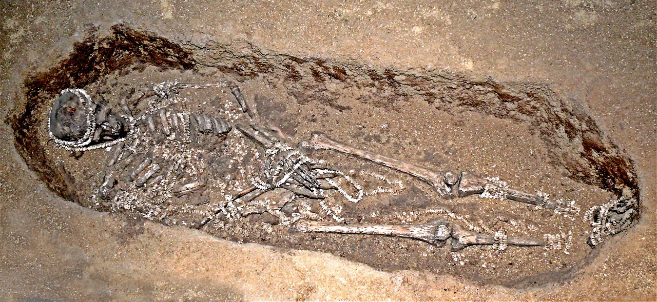 Sungir — Upper Paleolithic burial reconstruction showing ivory bead garments