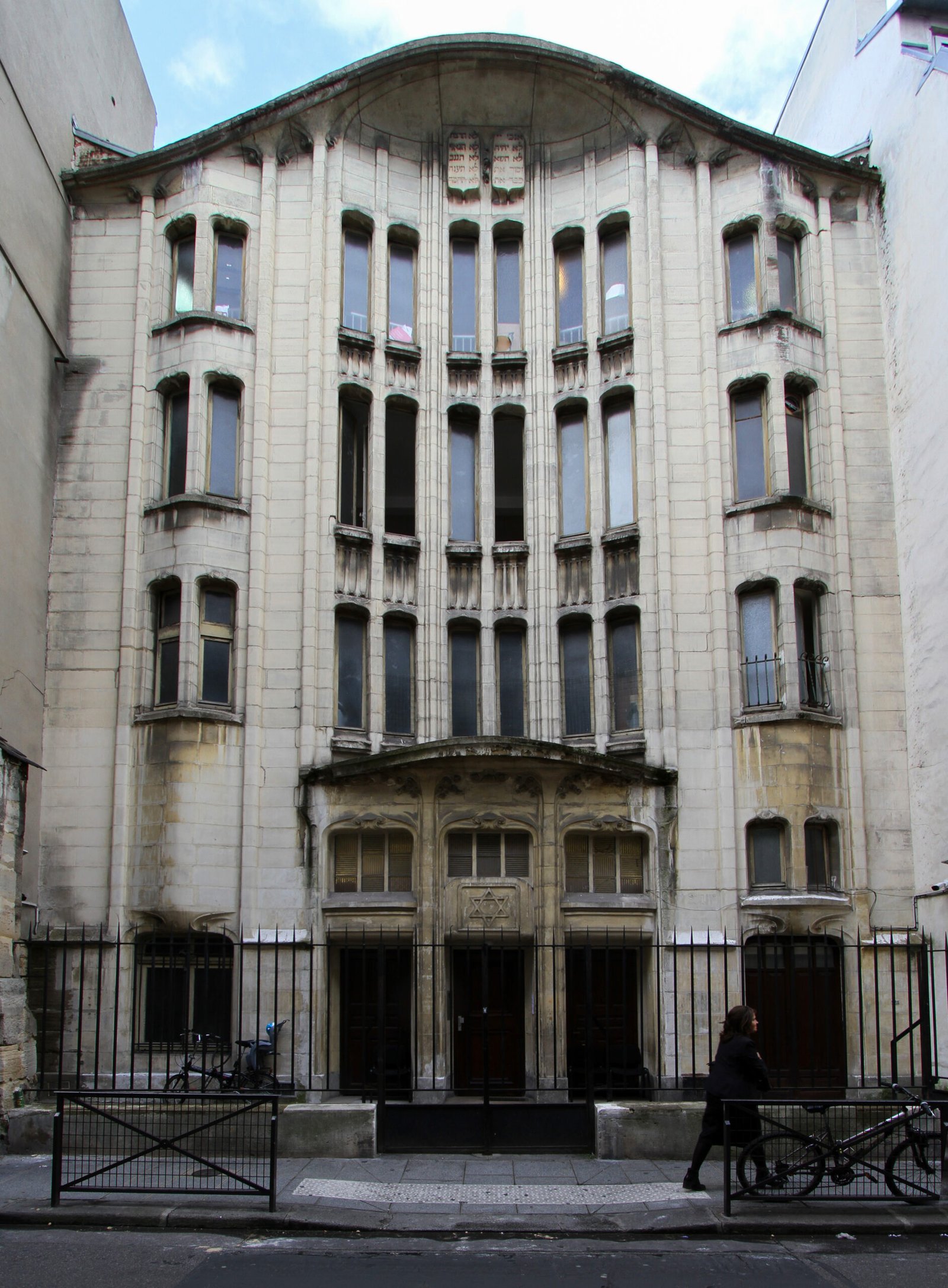 Undulating Art Nouveau stone façade of Hector Guimard's synagogue on rue Pavée, Le Marais, Paris