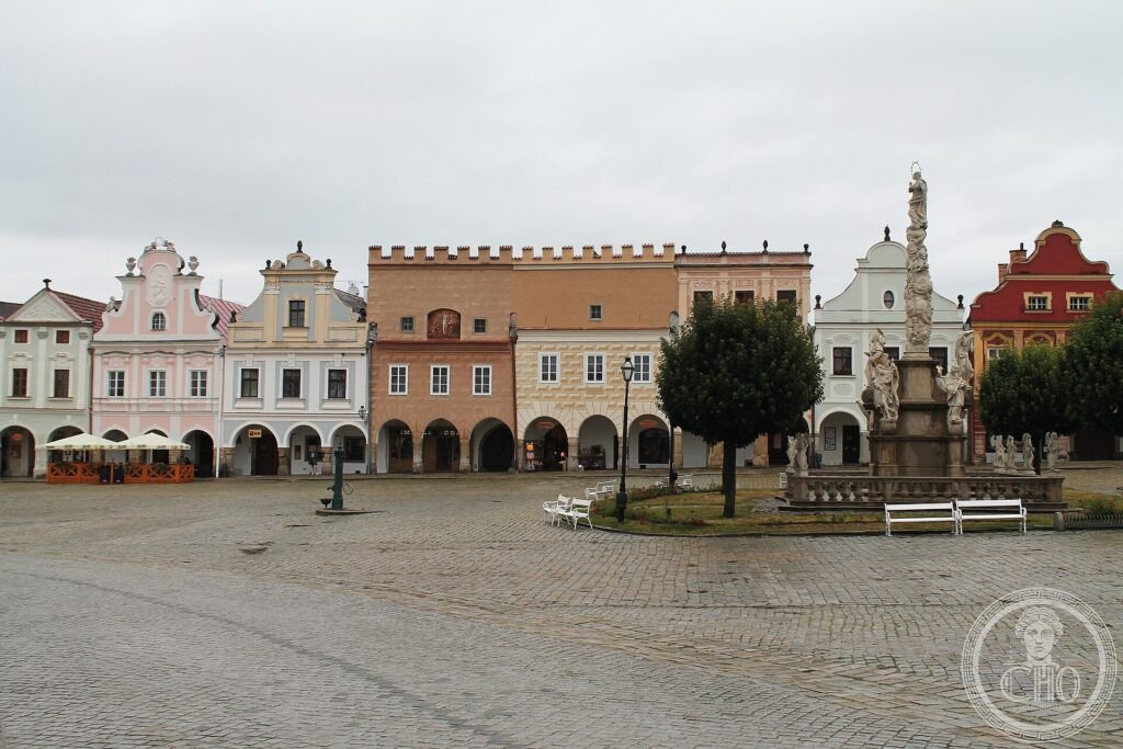 The long market square of Telč lined with colourful arcaded Renaissance houses