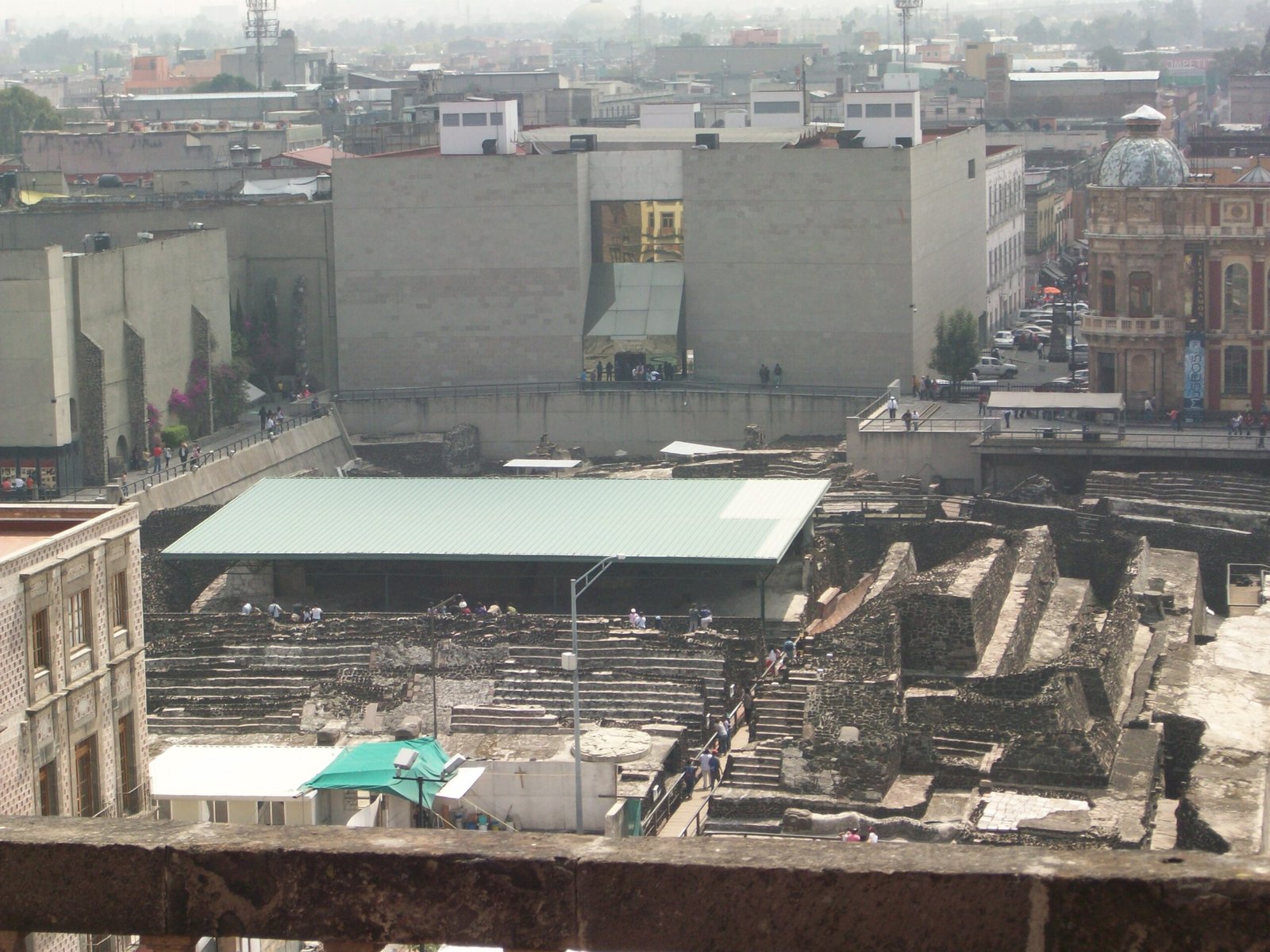 Excavated ruins of the Templo Mayor with Mexico City cathedral in the background