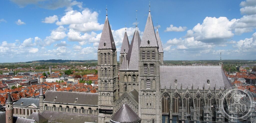 The five Romanesque towers of Tournai Cathedral rising over the town and its red roofs