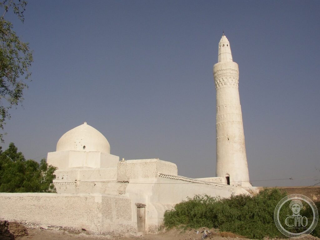 A whitewashed mosque with a tall minaret in the historic town of Zabid, Yemen