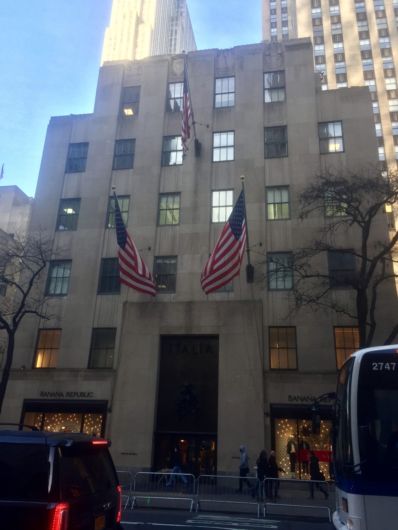 Fifth Avenue front of the Palazzo d'Italia with American flags