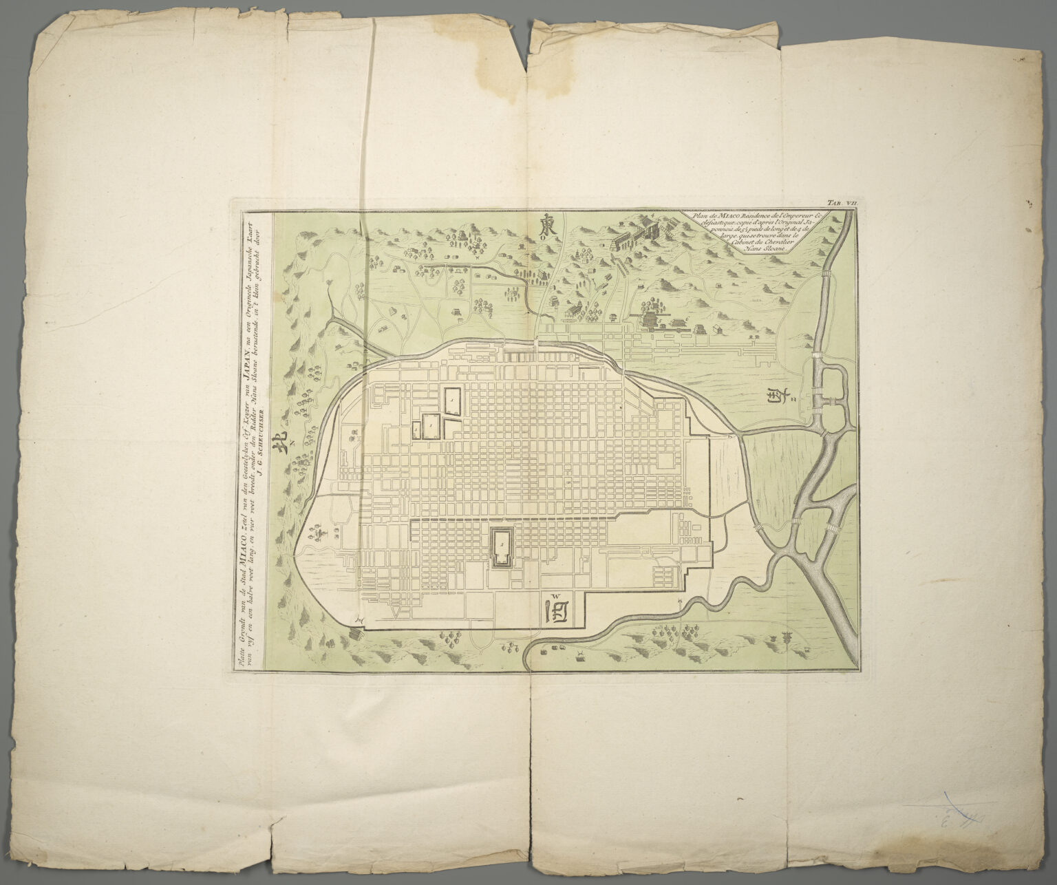 An old coloured map of Kyoto showing the city laid out as a rectangular grid of streets, with the palace enclosure marked inside it