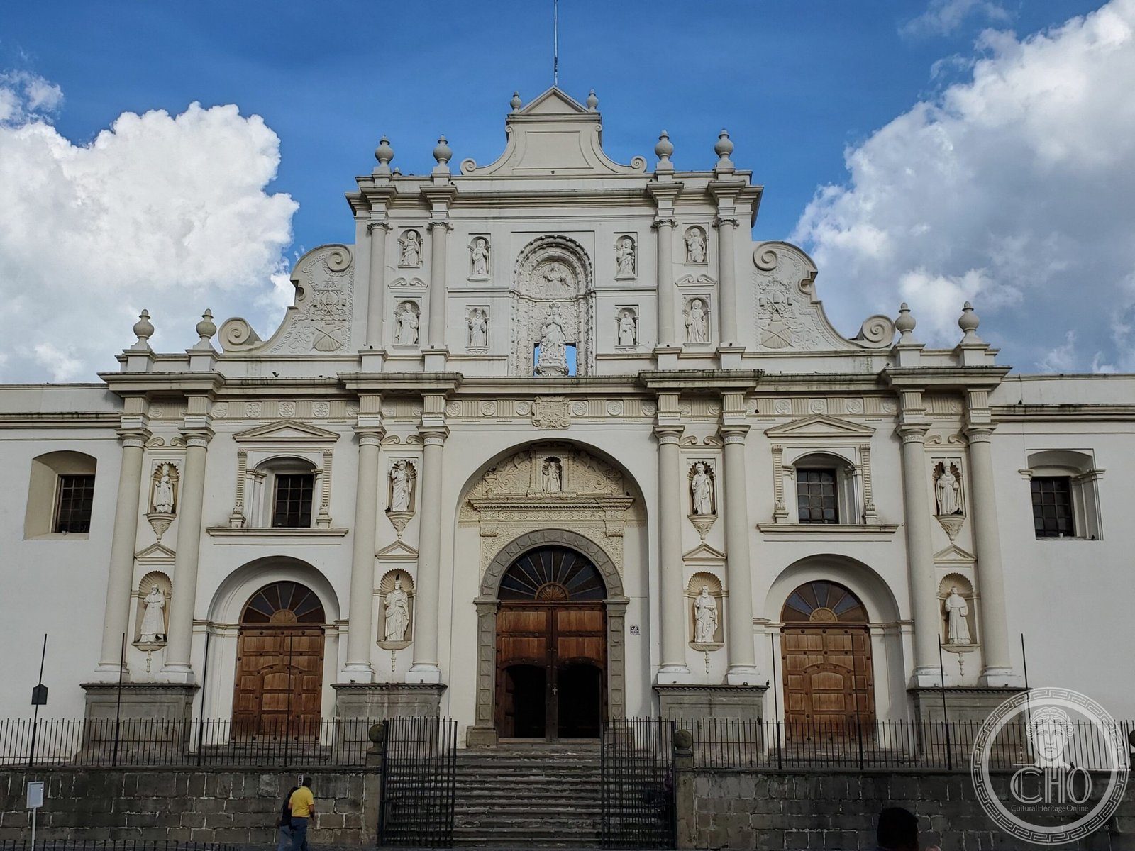 Facade of the Cathedral of Santiago (Church of San José) on Parque Central in Antigua Guatemala, a cream-colored Baroque facade with three arched doorways