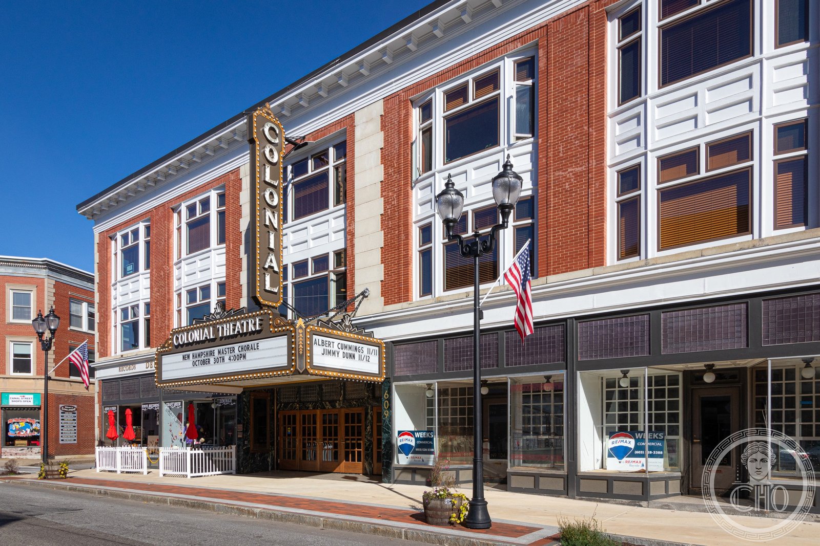 Colonial Theatre on Main Street, Laconia New Hampshire, white facade with vertical sign