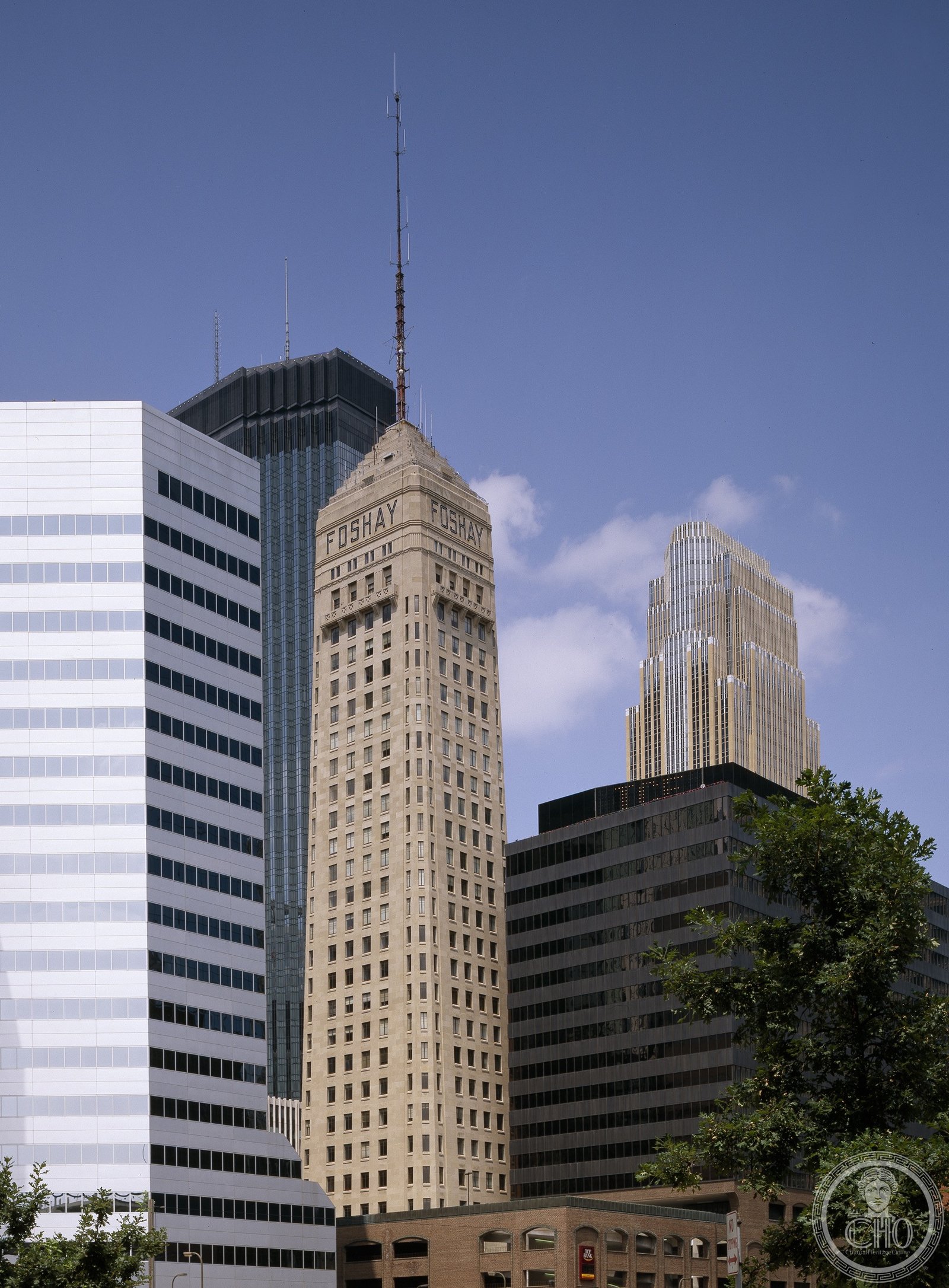 Foshay Tower rising above Marquette Avenue in Minneapolis, its obelisk silhouette against the Minnesota sky