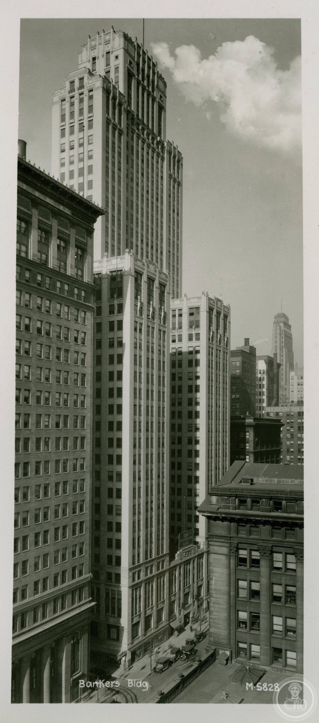 The Bankers Building's Art Deco facade rising above West Adams Street in Chicago's Loop, its limestone shaft tapering to a clean setback crown