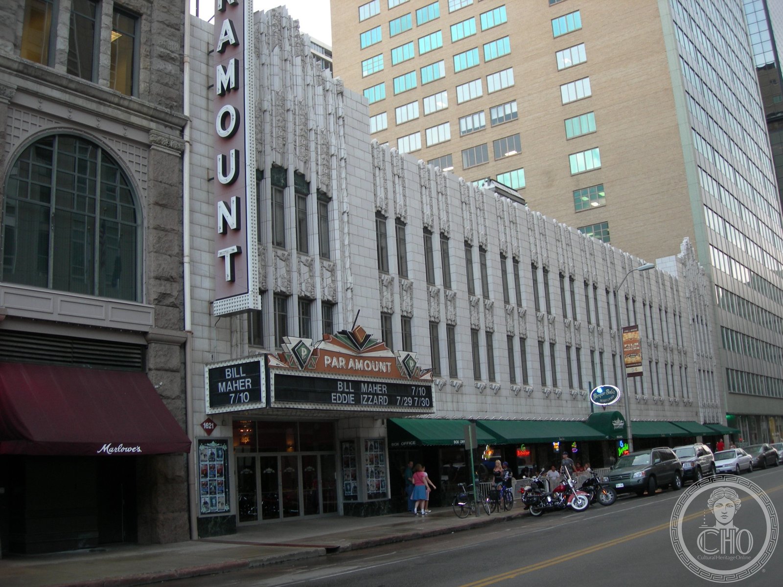 The vertical Art Deco marquee of the Paramount Theatre rising above Glenarm Place in downtown Denver, Colorado