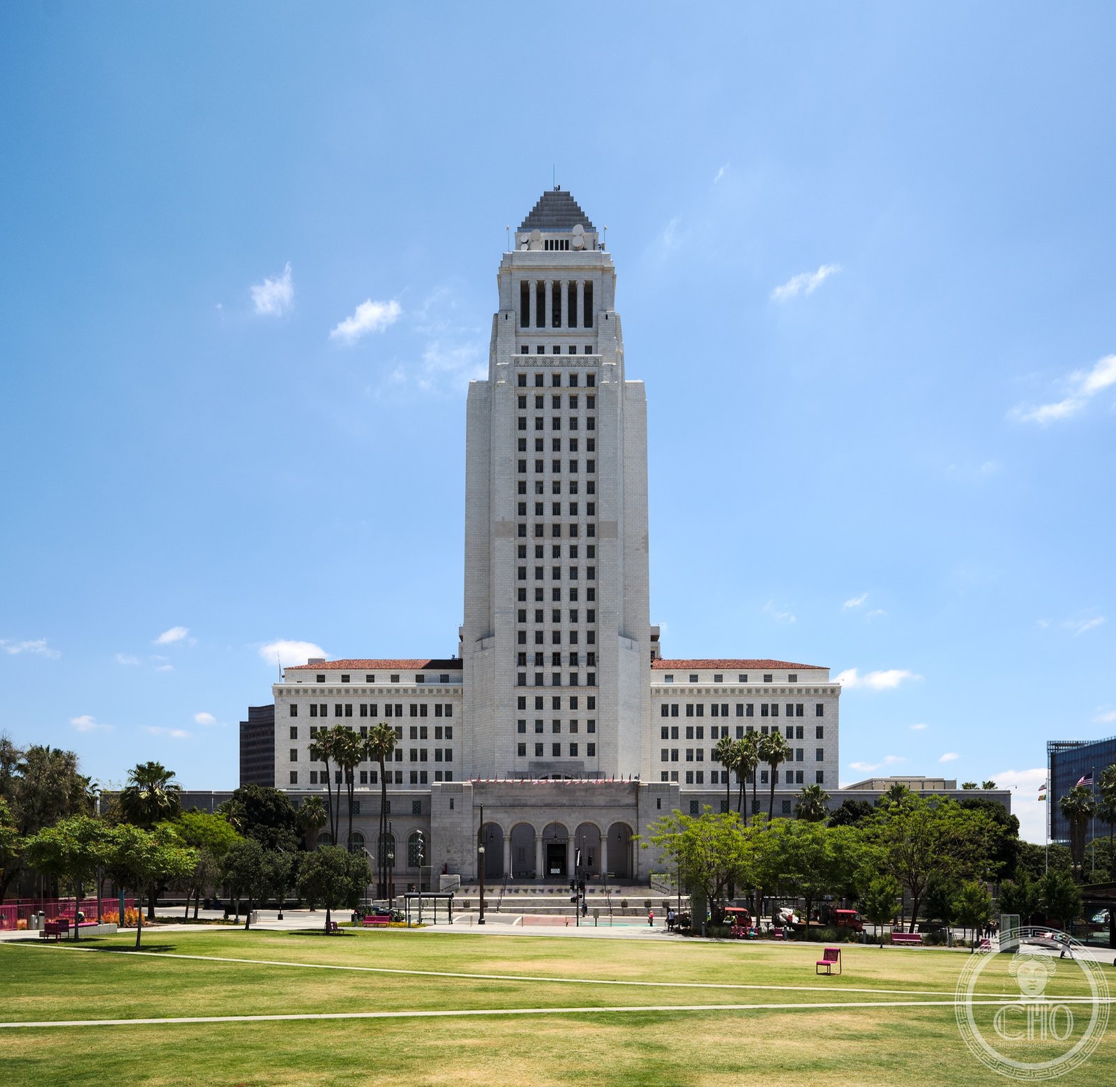 Los Angeles City Hall, a 28-story Art Deco tower rising above the Civic Center, with its distinctive tiered crown visible against the Southern California sky