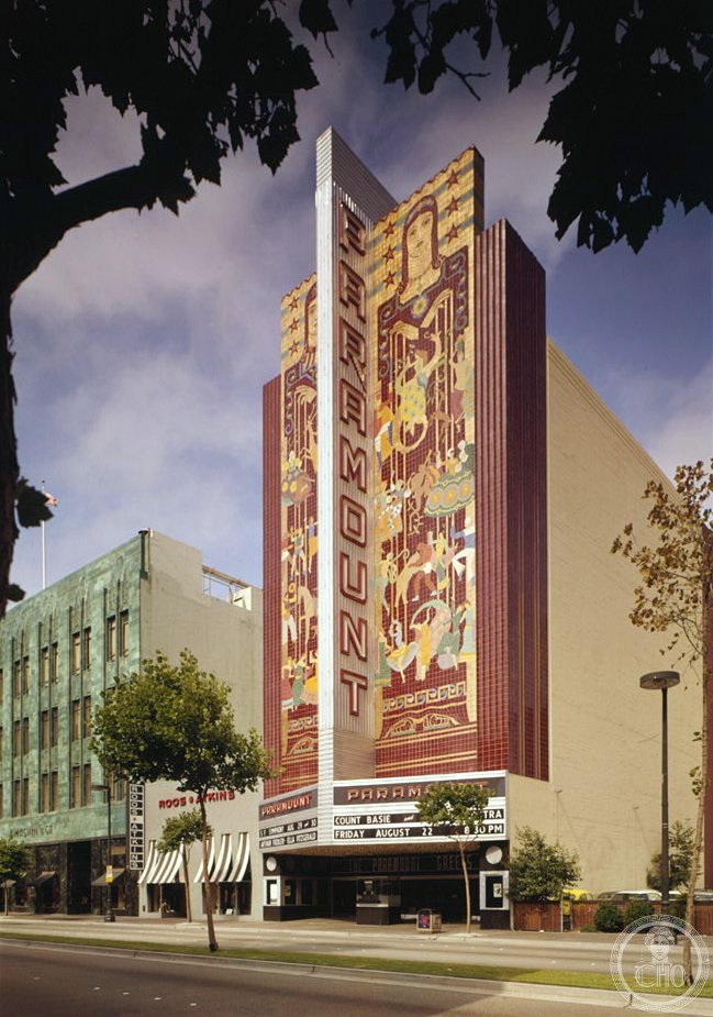 Paramount Theatre Oakland Art Deco facade on Broadway with mosaic panels and vertical sign