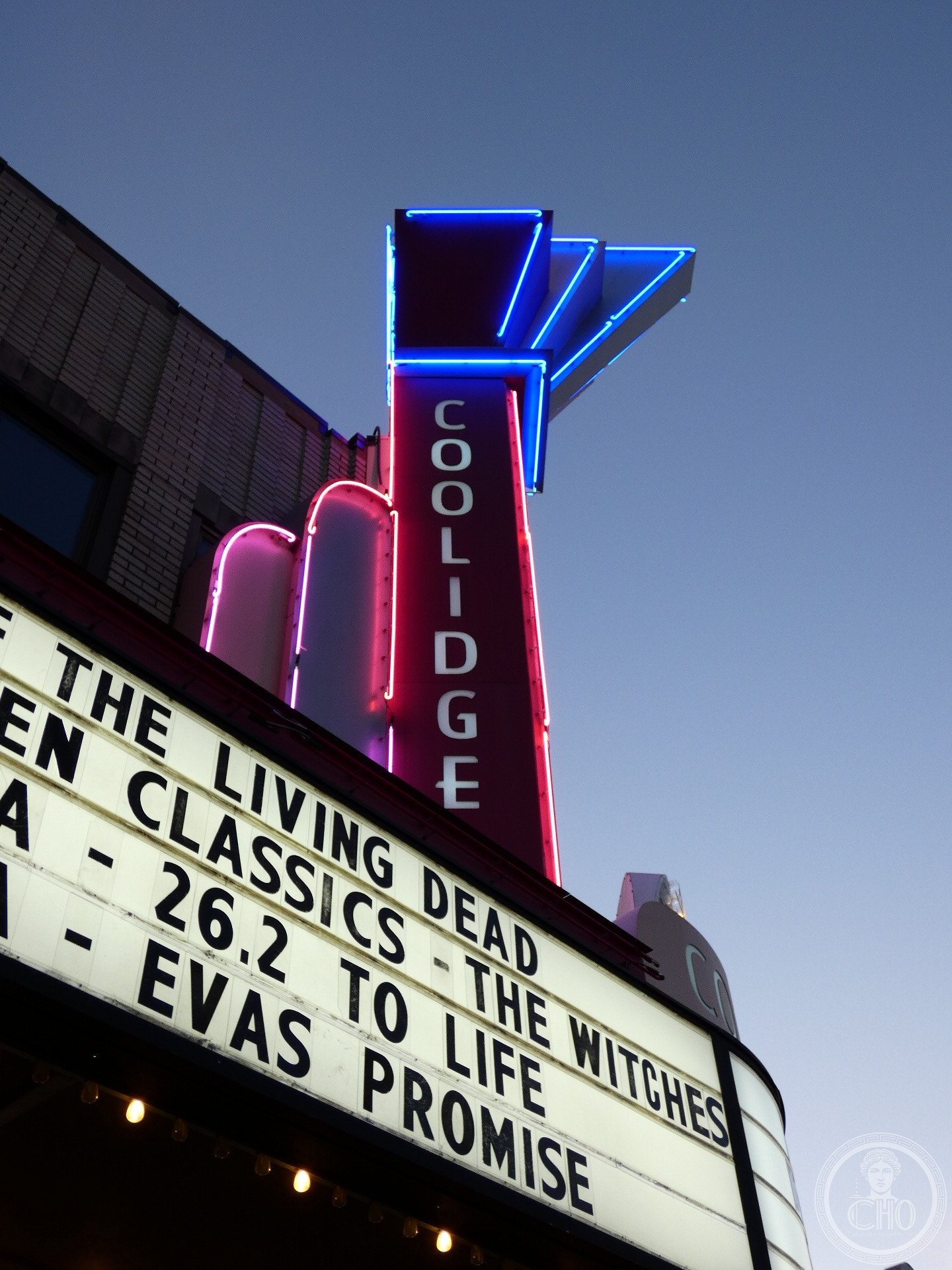 Coolidge Corner Theatre Brookline Art Deco exterior on Harvard Street with illuminated marquee