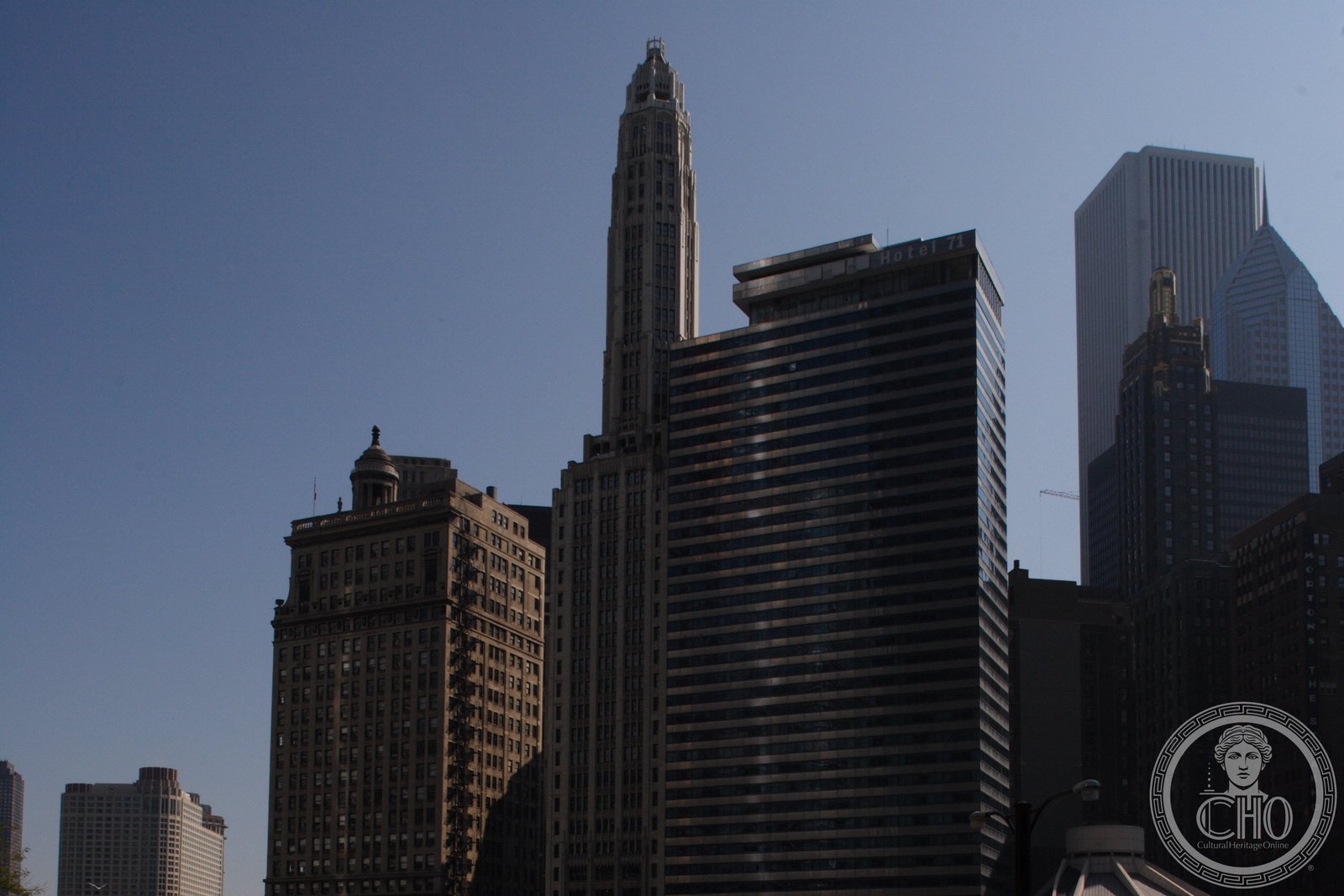 Mather Tower Art Deco Gothic spire rising above Chicago River skyline, East Wacker Drive, 1928