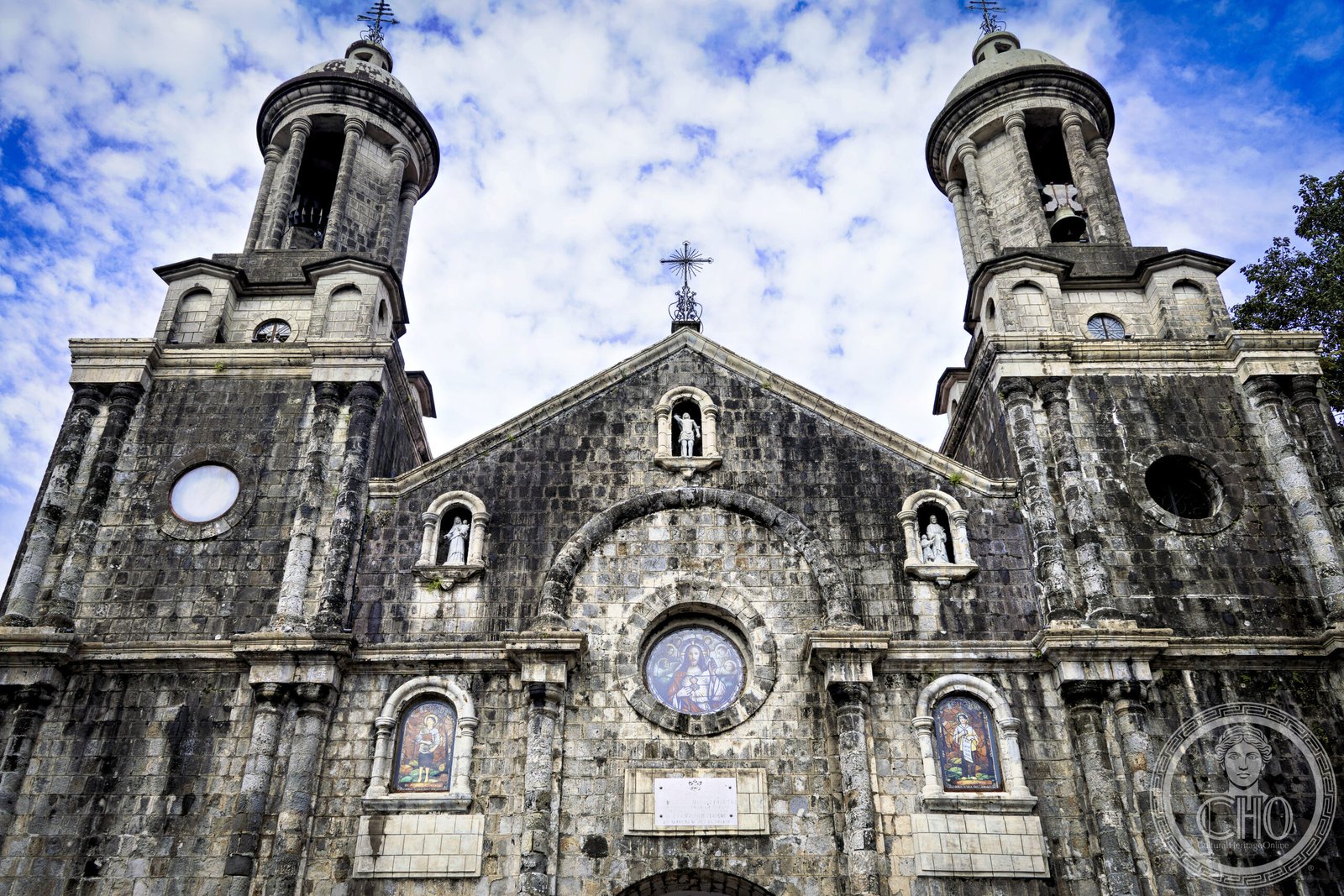 San Sebastian Cathedral in Bacolod City, Philippines, a stone Baroque facade with twin bell towers and a rose window
