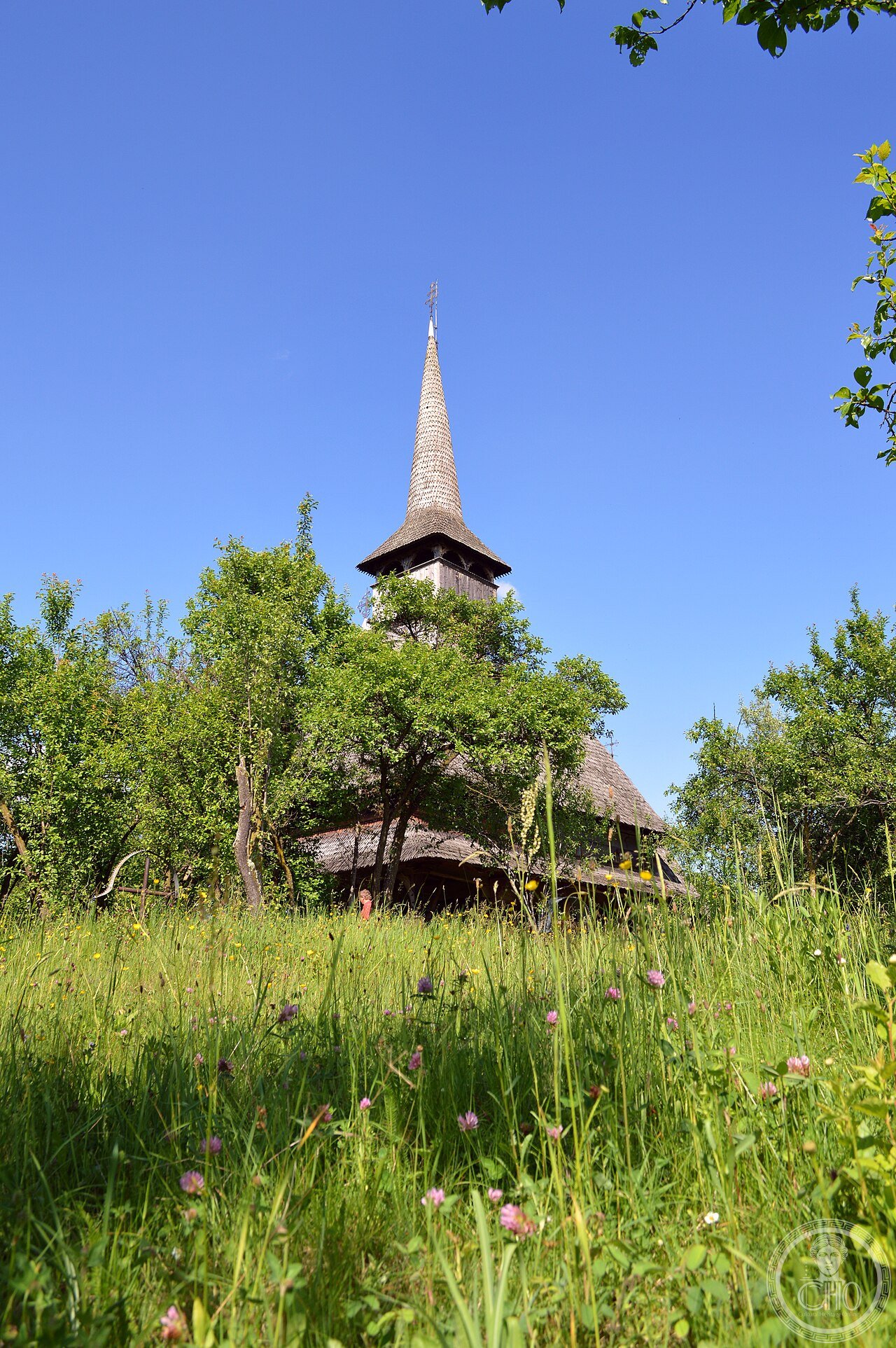The historic wooden Church of the Presentation of the Virgin at Bârsana, Maramureș, Romania, built around 1720 entirely of oak with a tall shingled steeple, part of the UNESCO Wooden Churches of Maramureș