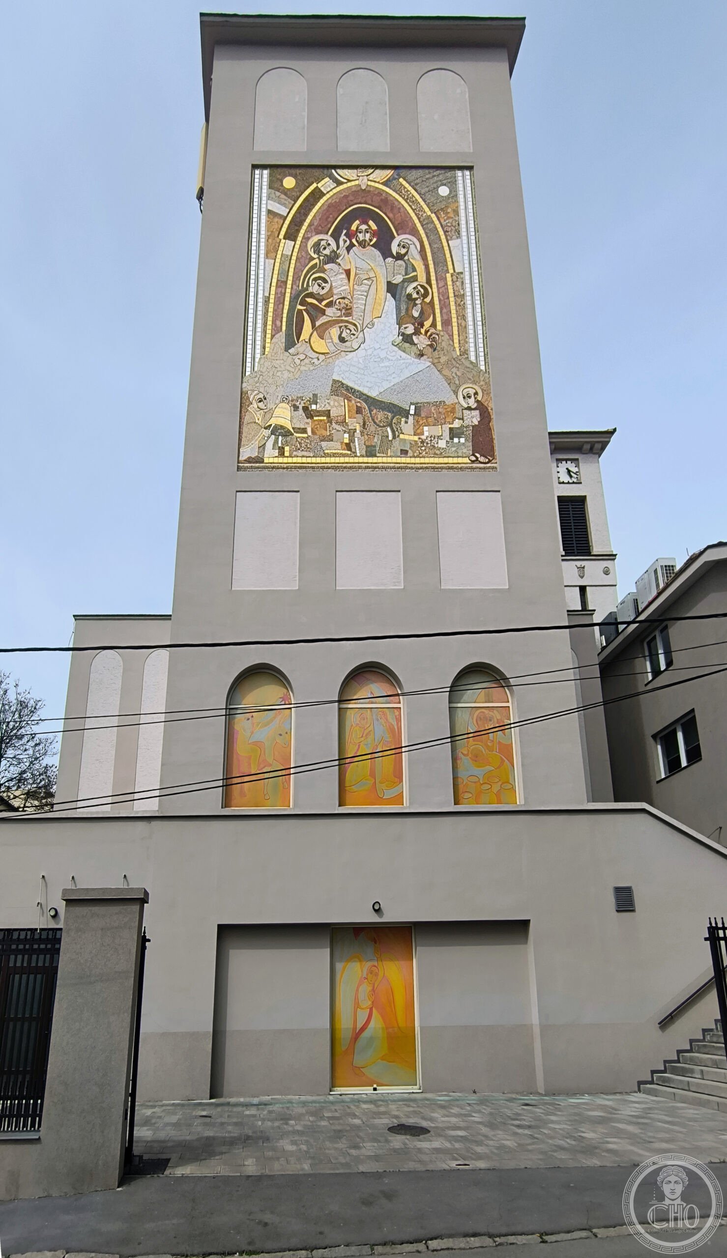 Cathedral of the Blessed Virgin Mary in Belgrade, Serbia, a brick bell tower crowned with a large Transfiguration mosaic above three stained-glass windows