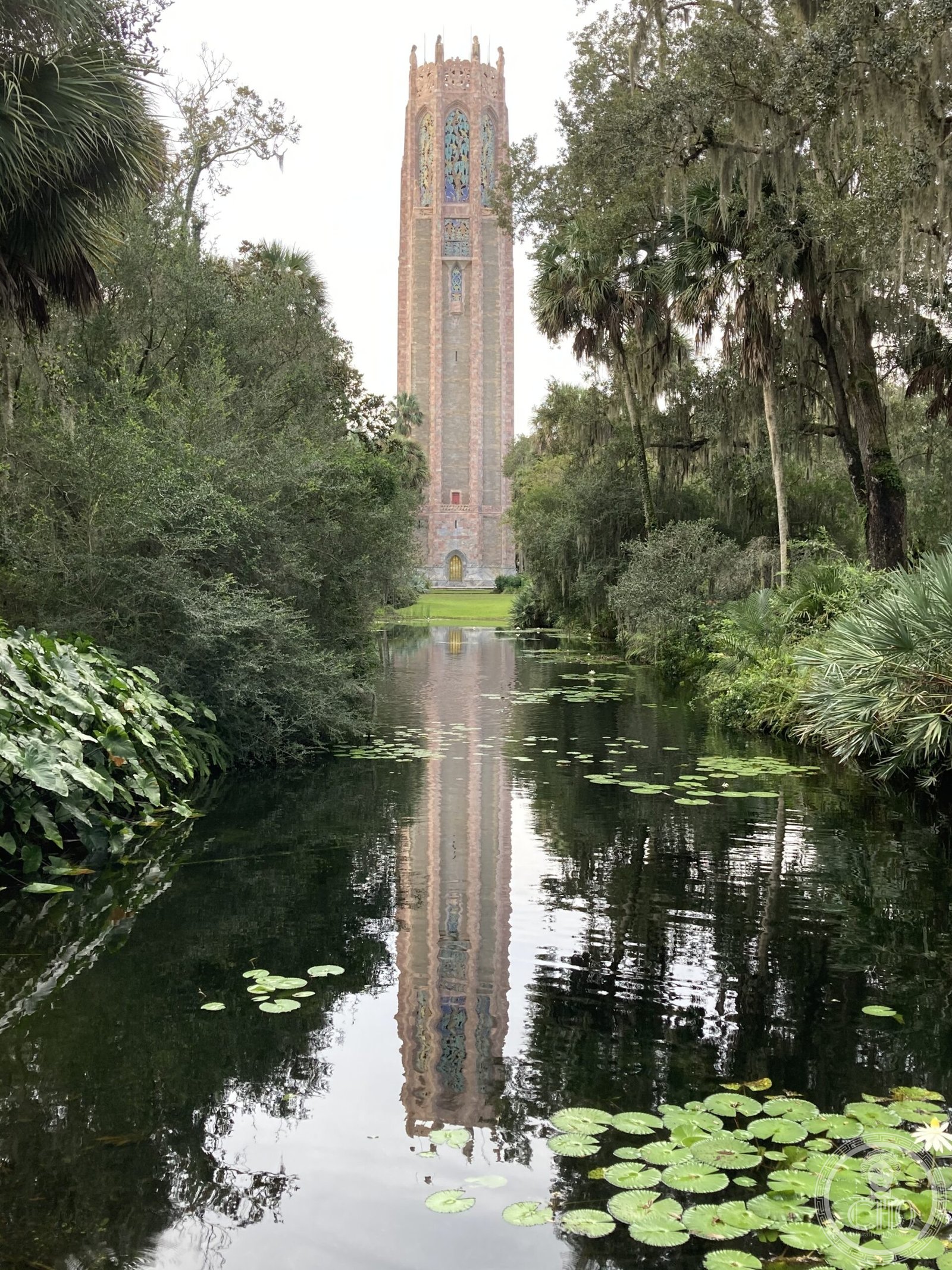 Bok Tower Gardens carillon tower, Lake Wales, Florida, Gothic Art Deco spire reflected in moat