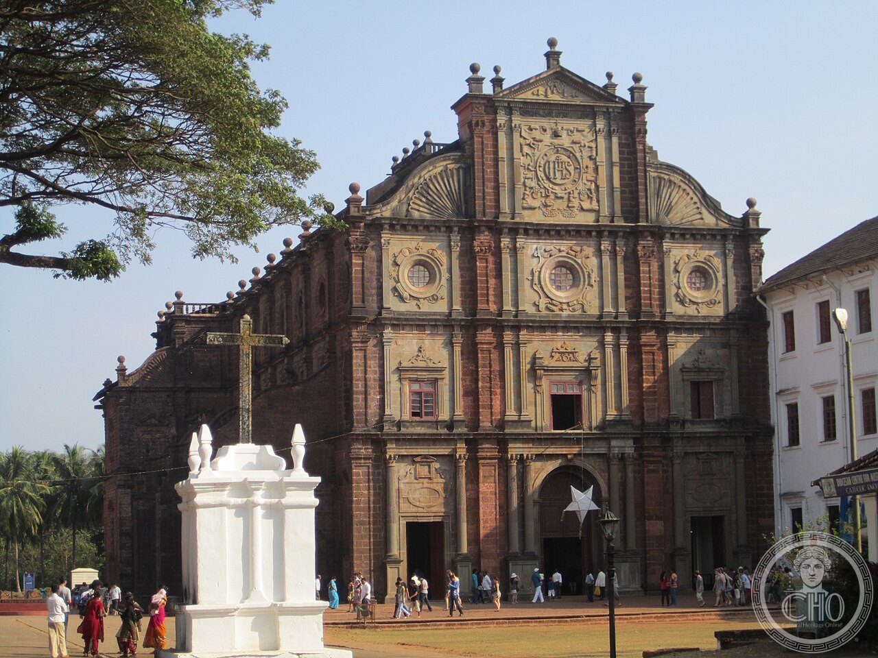 Basilica of Bom Jesus in Old Goa, India, its laterite stone facade left deliberately unplastered, holding the mortal remains of Saint Francis Xavier in a silver casket crafted by Florentine sculptor Giovanni Battista Foggini