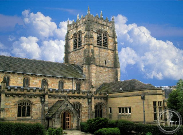 Gritstone tower and battlemented nave of Bradford Cathedral seen from Church Bank