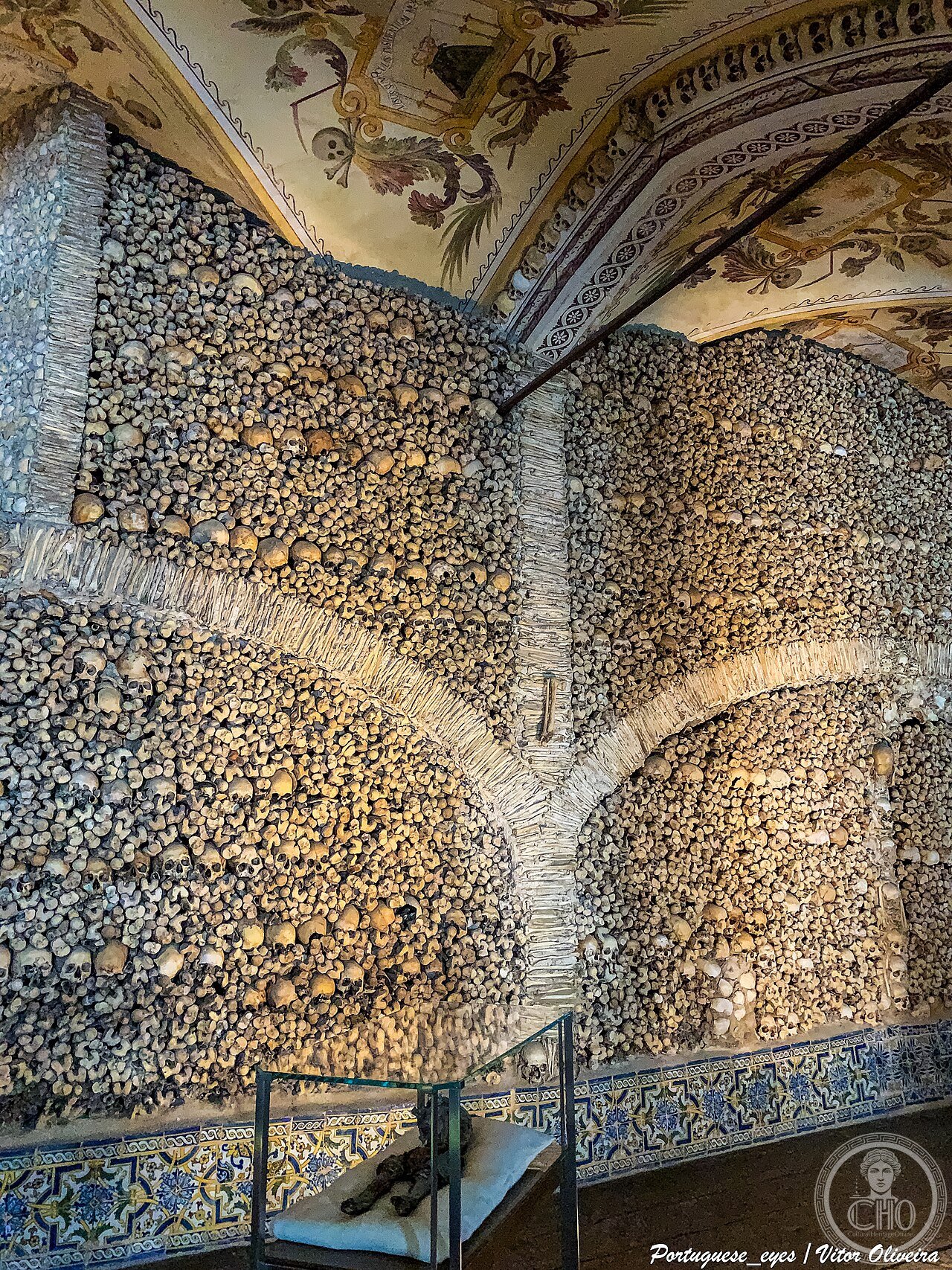 The interior of the Chapel of Bones in Évora, Portugal, its walls and columns lined with an estimated 5,000 human skulls and bones, built by Franciscan monks as a memento mori meditation space