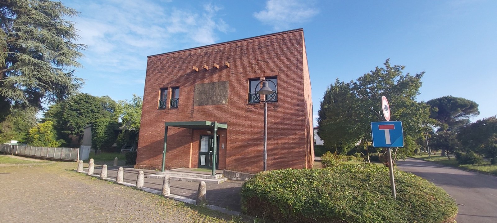 Brick ex Casa del Fascio of Rubano, a compact two-storey Rationalist block with a small bell