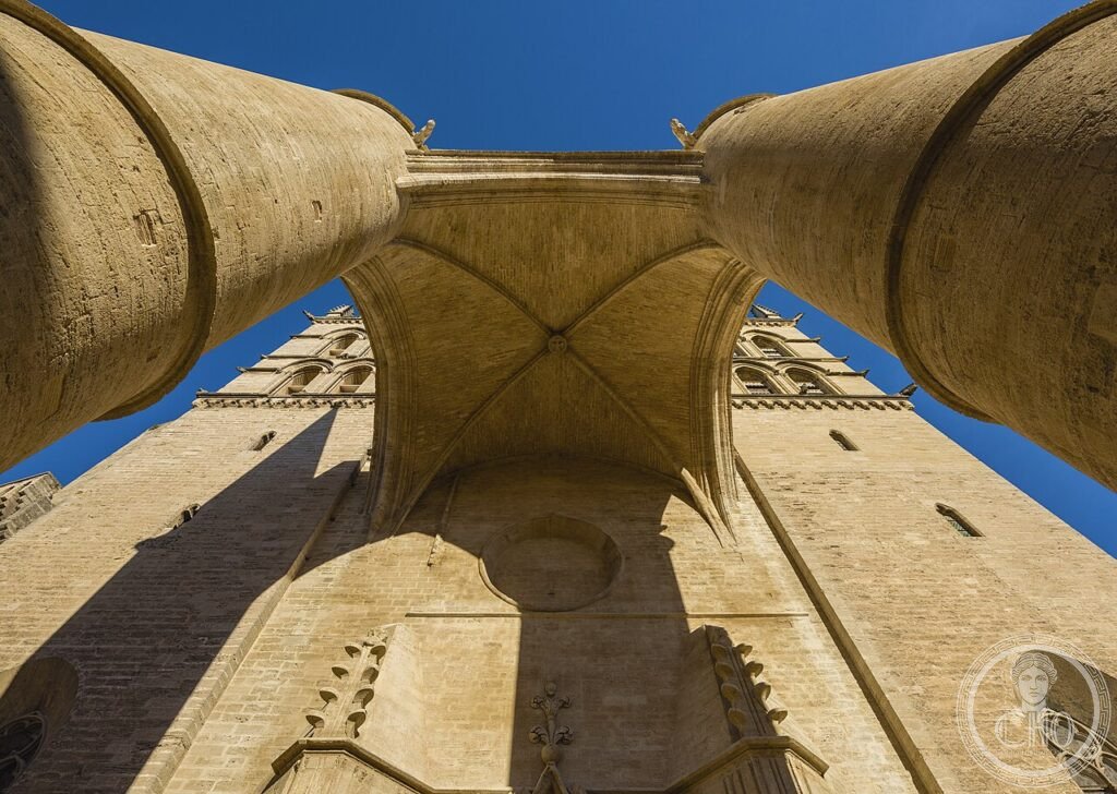 Exterior of Montpellier Cathedral (Cathédrale Saint-Pierre), Occitanie, France, with its fortress-like 14th-century porch of two 4.55-metre-diameter columns, directly adjoining the historic Faculty of Medicine