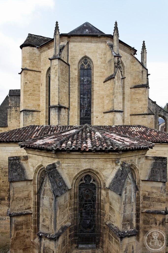 Exterior of Sarlat Cathedral (Cathédrale Saint-Sacerdos), Périgord, France, rebuilt 1125-1160 from a 9th-century Benedictine monastery, standing beside the enigmatic 12th-century Lanterne des Morts tower
