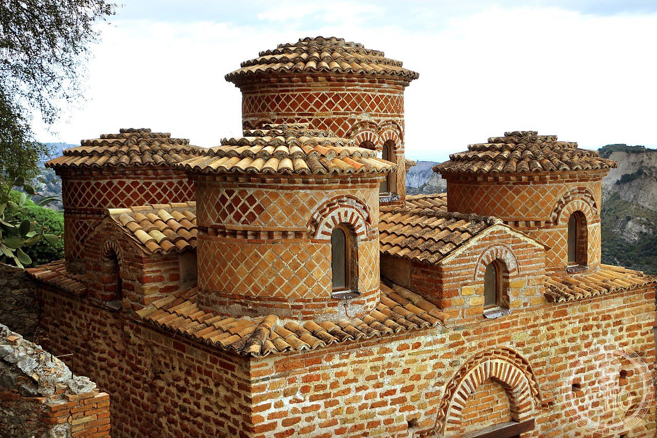 Exterior of the Cattolica di Stilo in Calabria, Italy, a 10th-century Byzantine church with five brick cylindrical domes, considered one of the finest examples of Byzantine architecture in Italy