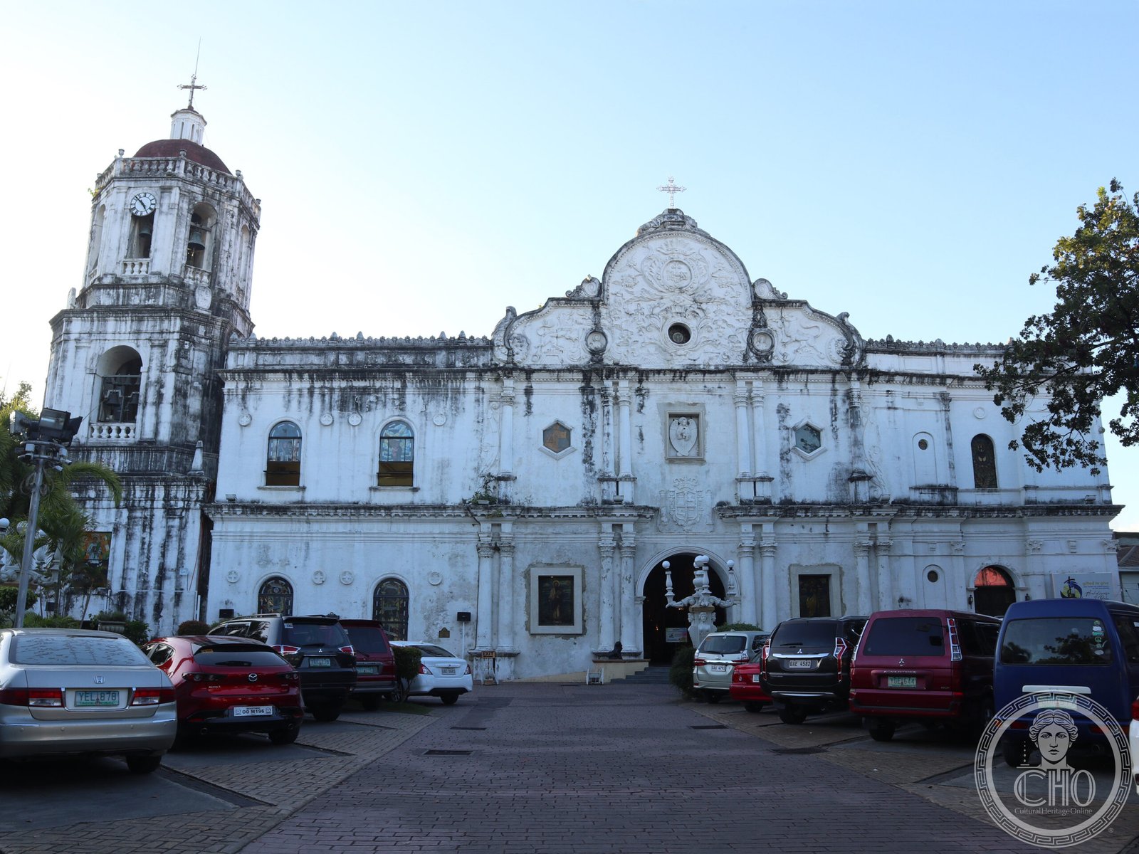 Cebu Metropolitan Cathedral in the Philippines, a white baroque facade with a single bell tower topped by a dome and clock