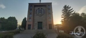 Chiesa della Sacra Famiglia — Padua, San Giuseppe Quarter (1936–1940) — The facade seen frontally, the circular Holy Family relief centred in the gable.