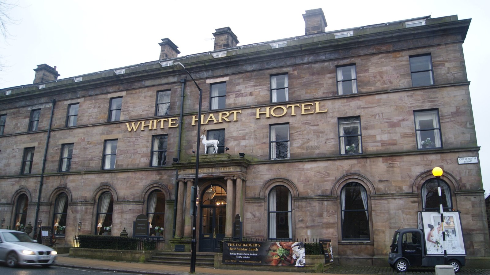 The long classical stone frontage of the White Hart Hotel in Harrogate's Montpellier Quarter