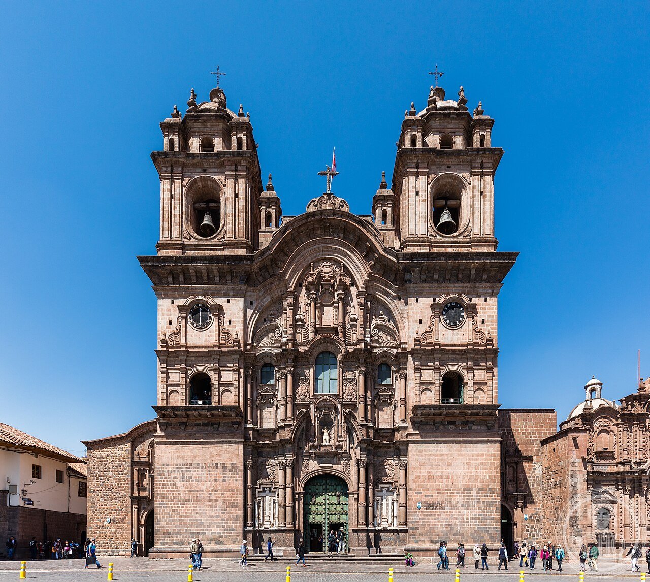 Church of the Society of Jesus on the Plaza de Armas in Cusco, Peru, built on the site of the Inca palace of Huayna Cápac, its Baroque facade so grand it sparked a legendary rivalry with the neighboring cathedral