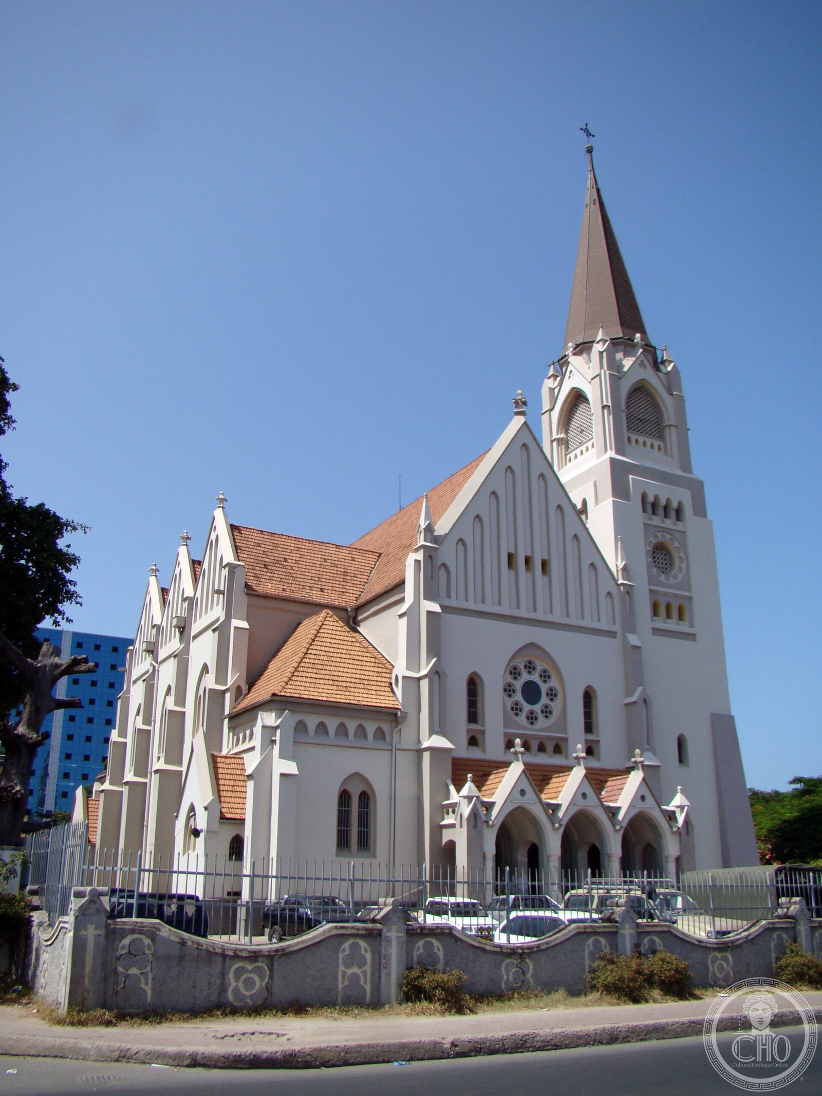 St. Joseph's Metropolitan Cathedral in Dar es Salaam, Tanzania, a white neo-Gothic church with a tall spire and rose window facing the harbor